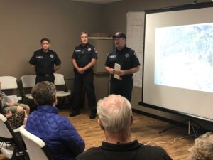 Fire fighters giving a presentation to a local community at their HOA meeting.